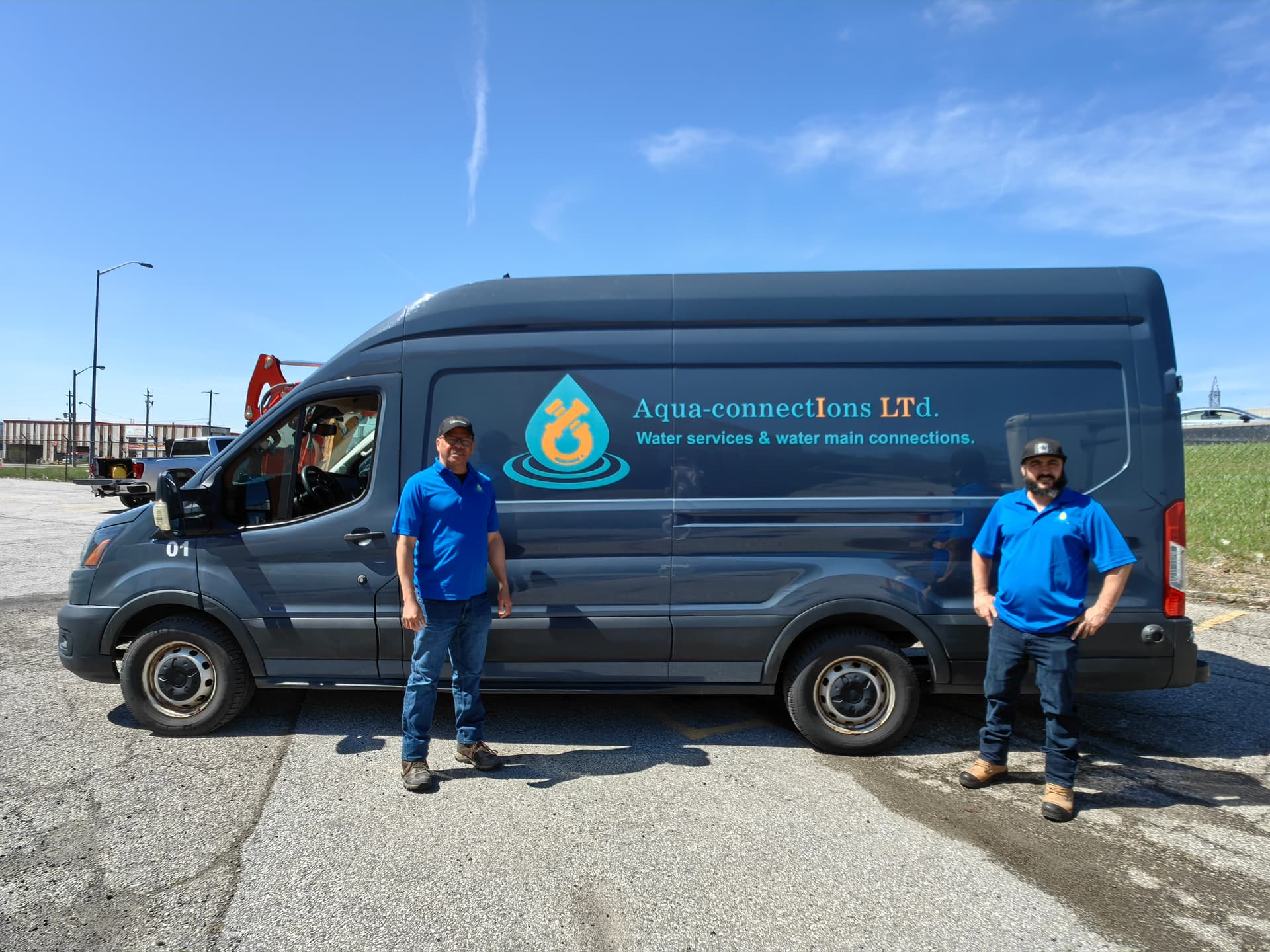 Aqua-Connections founders with Kubota excavator